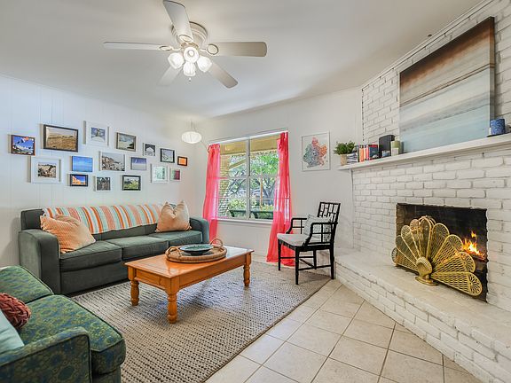 Large family room with corner fireplace.