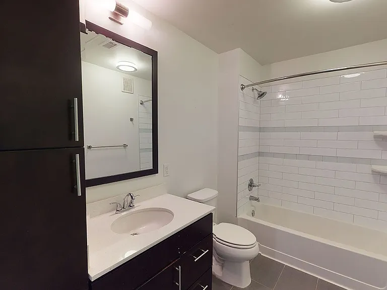 Bathroom with tile flooring.