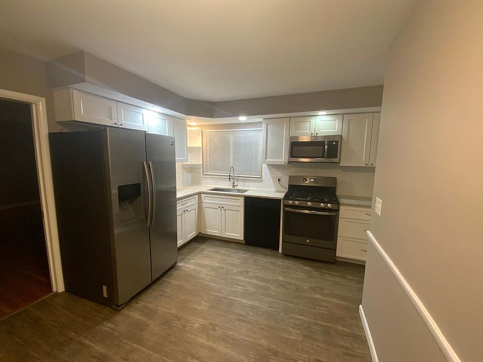 Refinished Kitchen with granite countertops, new cabinets and updated appliances.