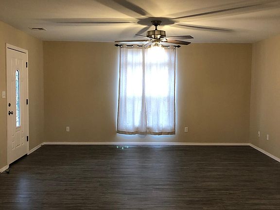 Living room 16_2_ w by 19_9_ long. New vinyl plank waterproof flooring and fan/light with remote control