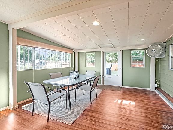 Sunroom just off dining room leads to back yard