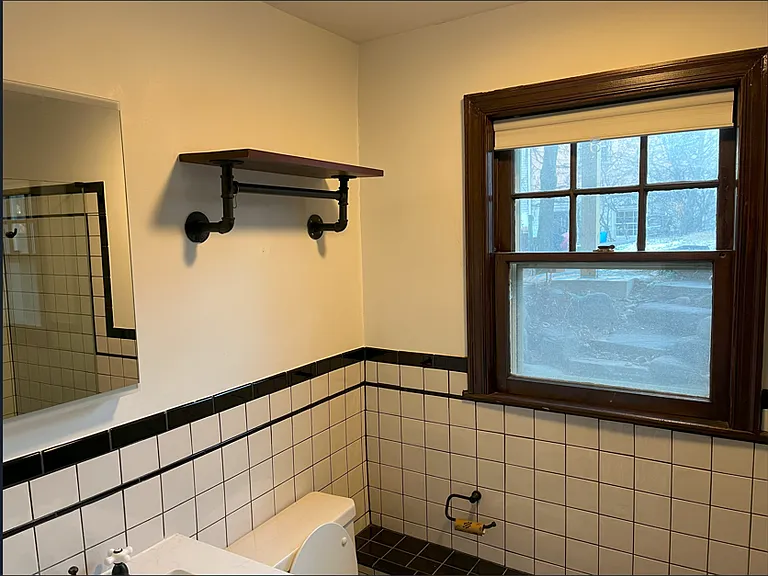 Bathroom contains a large window.