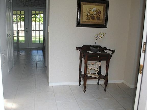 Welcome!  What a lovely place to greet your guests!  Look at the backyard beckoning you!