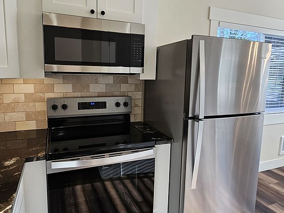 Kitchen with stainless steel appliances.