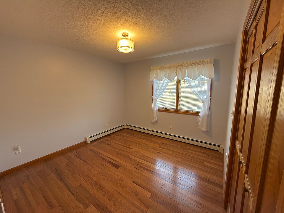 Rental bedroom: unfurnished, front-facing, hardwood floors, double windows, lots of natural light, baseboard radiators, closet space, lots of power outlets