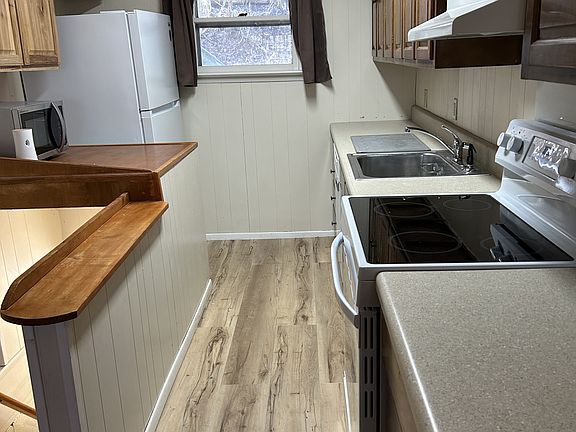 Kitchen with Prep area next to refrigerator