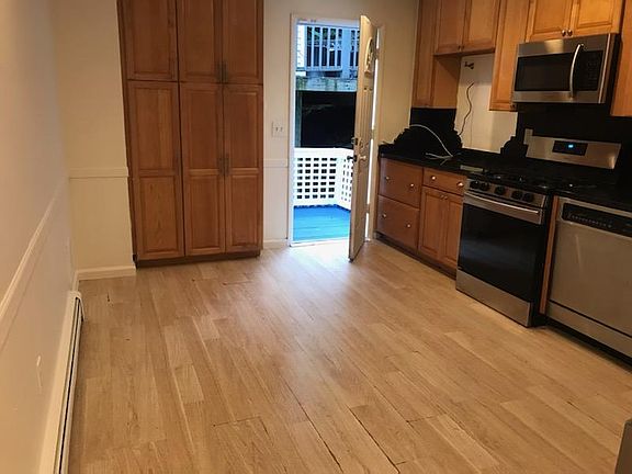 Renovated Kitchen Lead to freshly Painted Private Patio. Stainless Steel Appliances