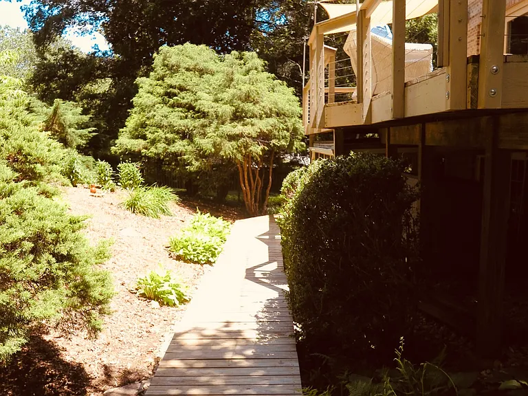 Boardwalk to lower level screen porch.