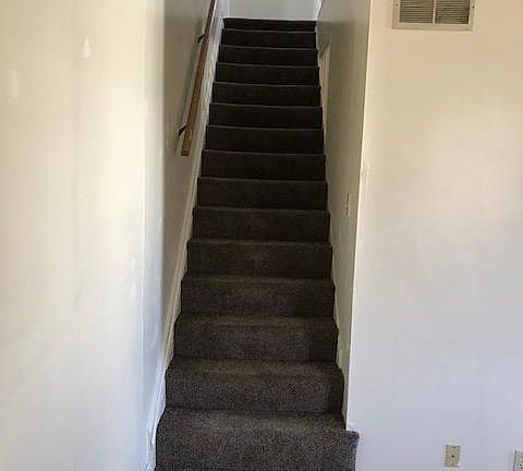 Stairs to bathroom and bedroom