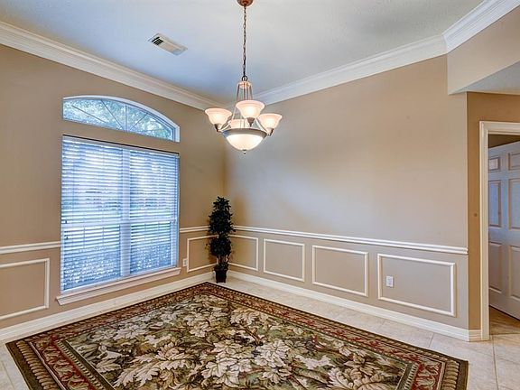 Formal Dining Room, tile floors and chair rail, decorative molding and crown molding