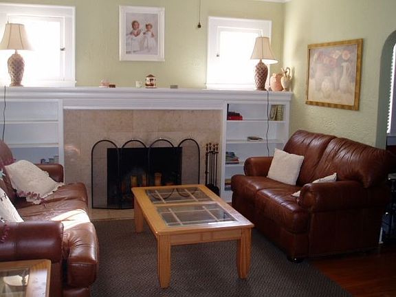 Fireplace, Crown Molding and 8" Baseboards enhance this living room!