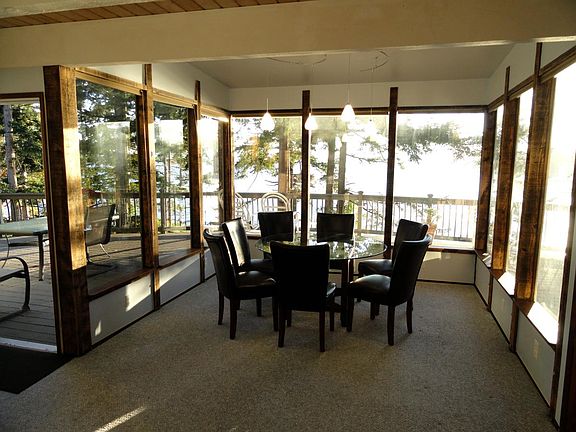 The dining room overlooks Elger Bay, with windows on three o