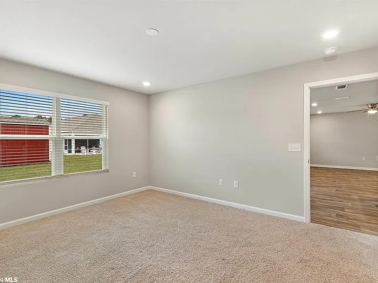 Master Bedroom with double Window to Back yard.