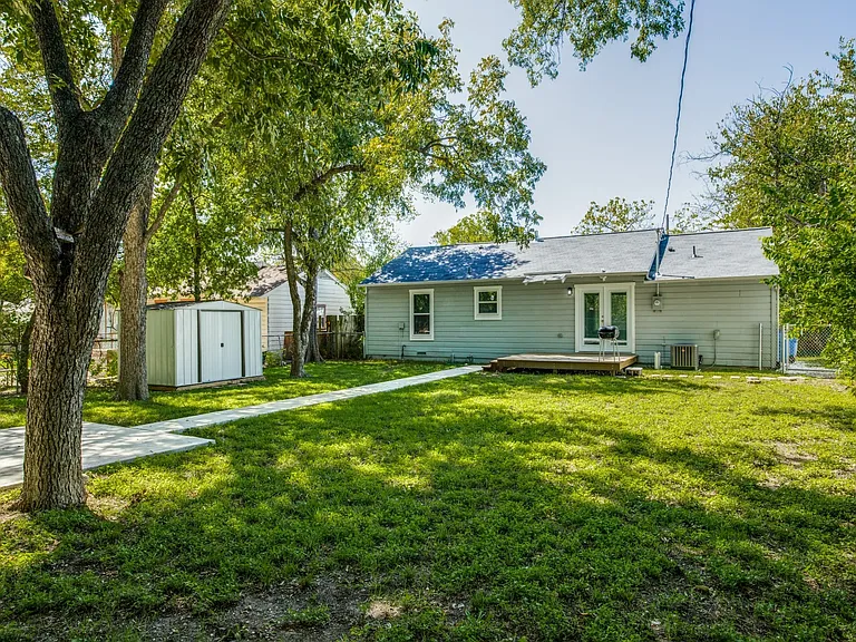 Large Backyard with deck and rear parking pad.