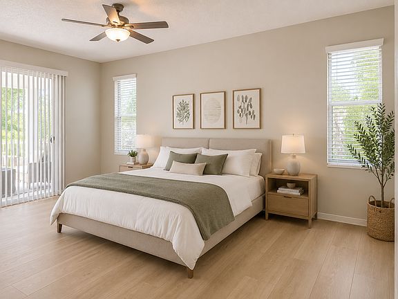 primary bedroom with slider to the pool/large lanai. Dual walk in closets and en suite bath
