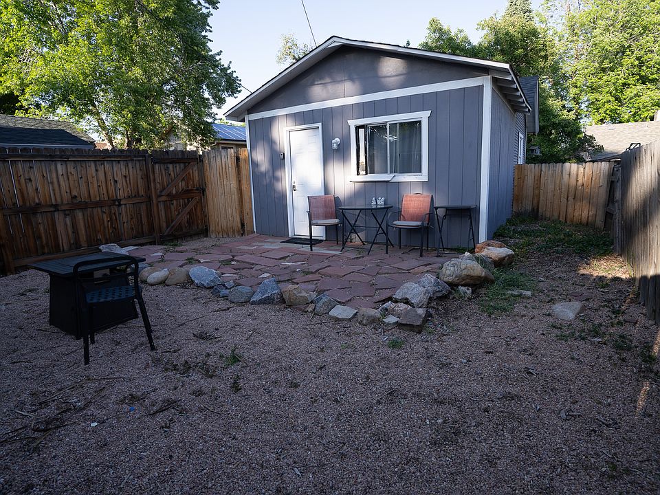 Carriage House private back yard space with fire table.