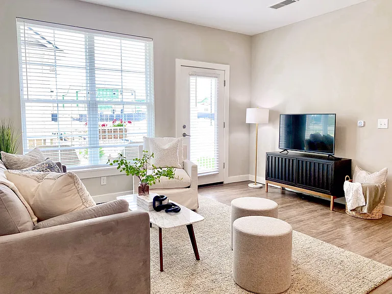 Cozy, open, and full of natural light_the Aster's living room is made for everyday comfort and easy entertaining. Cozy, open, and full of natural light_the Aster's living room is made for everyday comfort and easy entertaining.