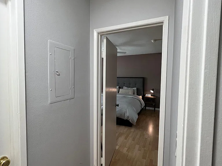 Please note: Pre-renovation photo shown for layout reference. Brand-new flooring has since been installed.