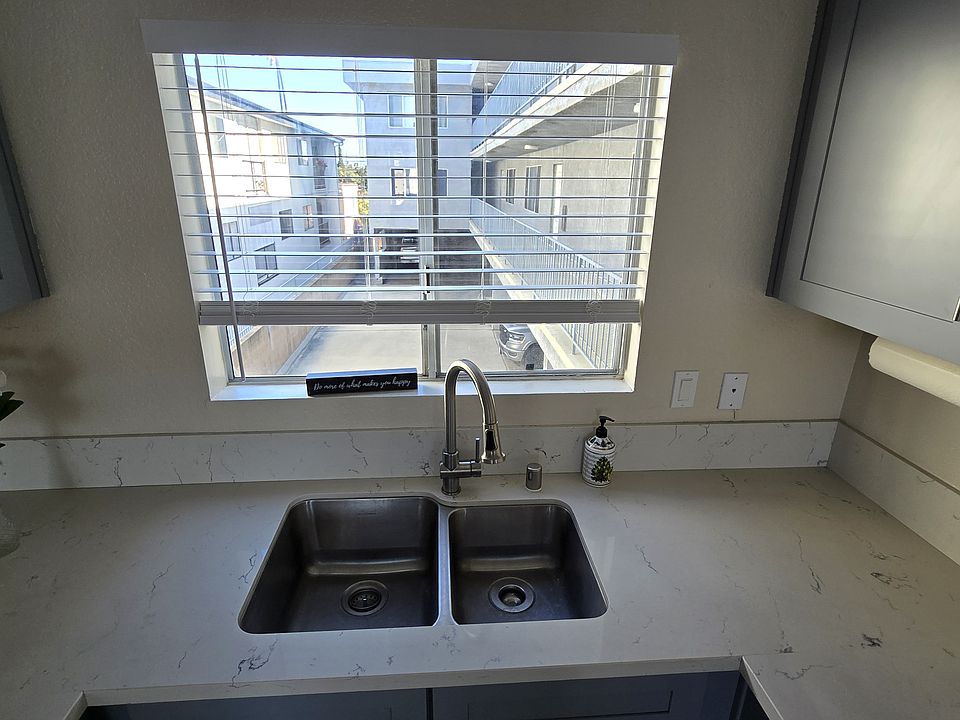Undermounted double bowl, stainless steel sink with sprayer/hose faucet