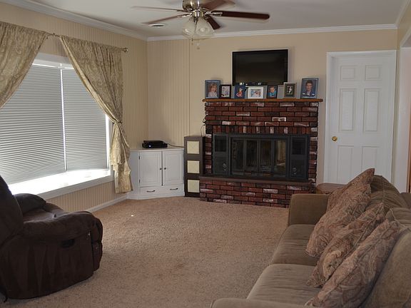 Living Room w/ wood burning fireplace