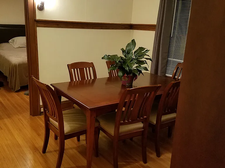 With dining room table looking from living room towards south west corner
