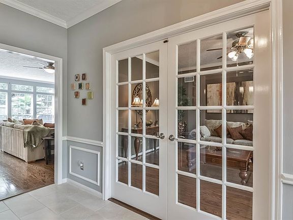 A handsome study is to the right of the foyer