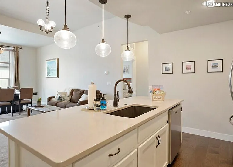 Huge Island with modern undermount sink and pull down faucet
