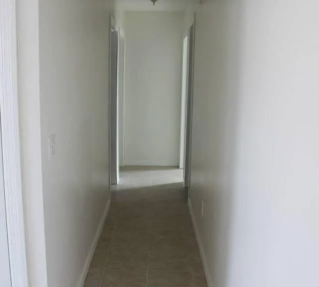 Hallway to other 3 bedrooms