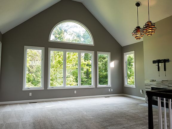Tons of natural light with leafy summer views and view of Geist through the winter branches