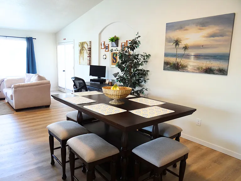 Spacious open-concept dining, living, and kitchen area.