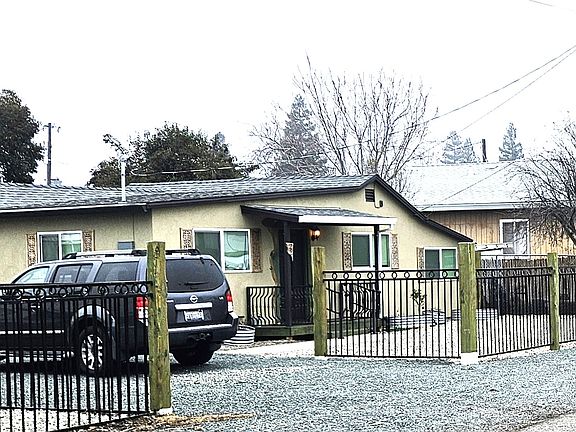 Front with Custom Rod Iron & Live Edge perimeter fence. (South to North)