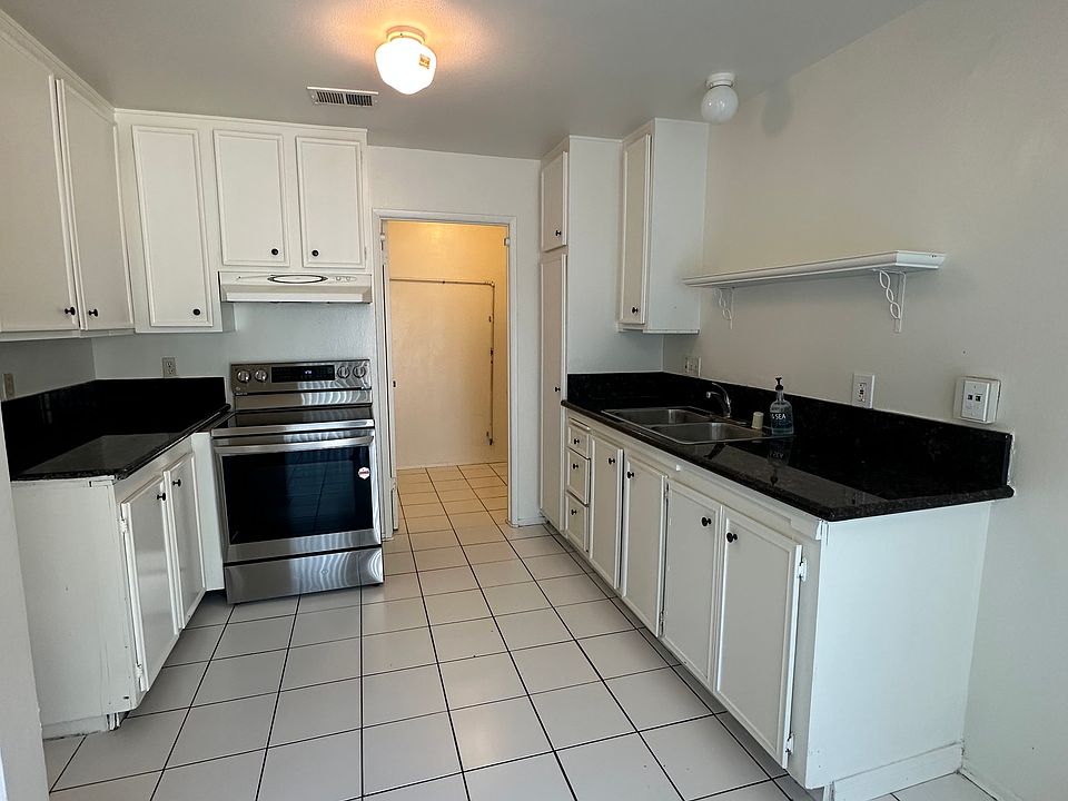 Kitchen with laundry room in back.