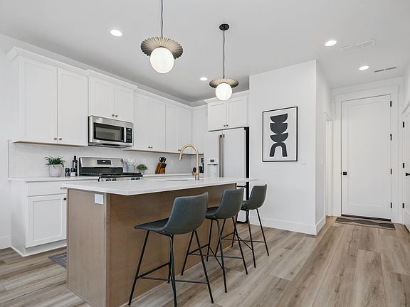 Kitchen with new Cafe refrigerator
