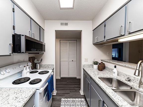 Kitchen with granite counters and modern cabinetry