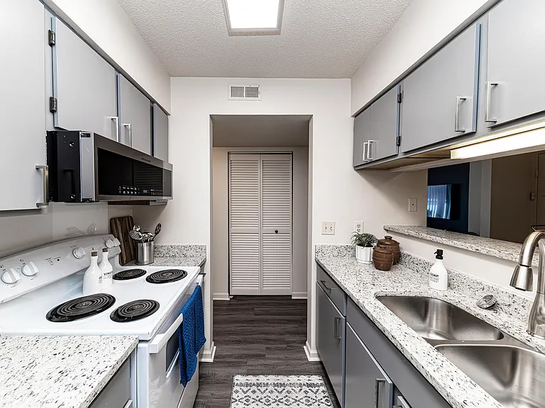 Kitchen with granite counters and modern cabinetry