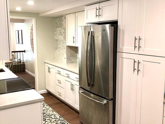 Updates kitchen with quartz countertops