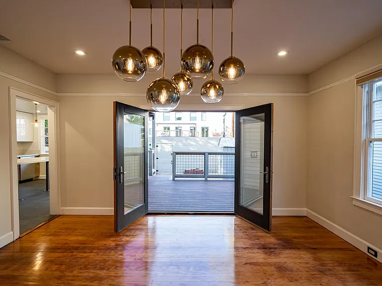Dining room to deck 1. This deck is also accessed by the French doors in the kitchen