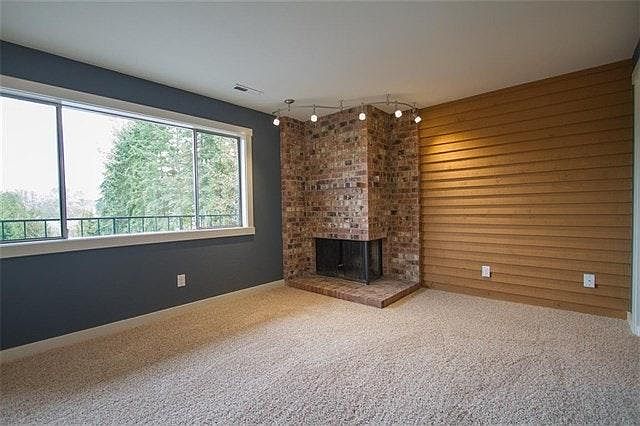 Living room overlooks deck area