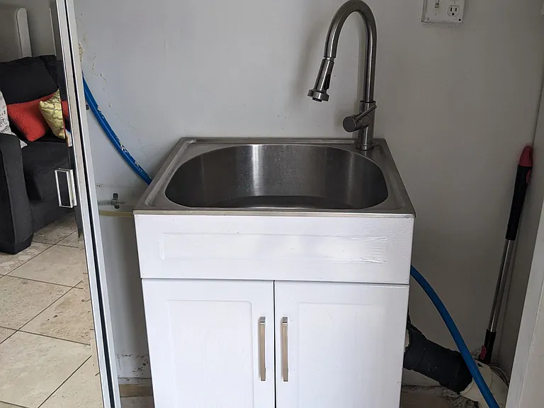 sink for dishes or washing clothes, enclosed with mirror door