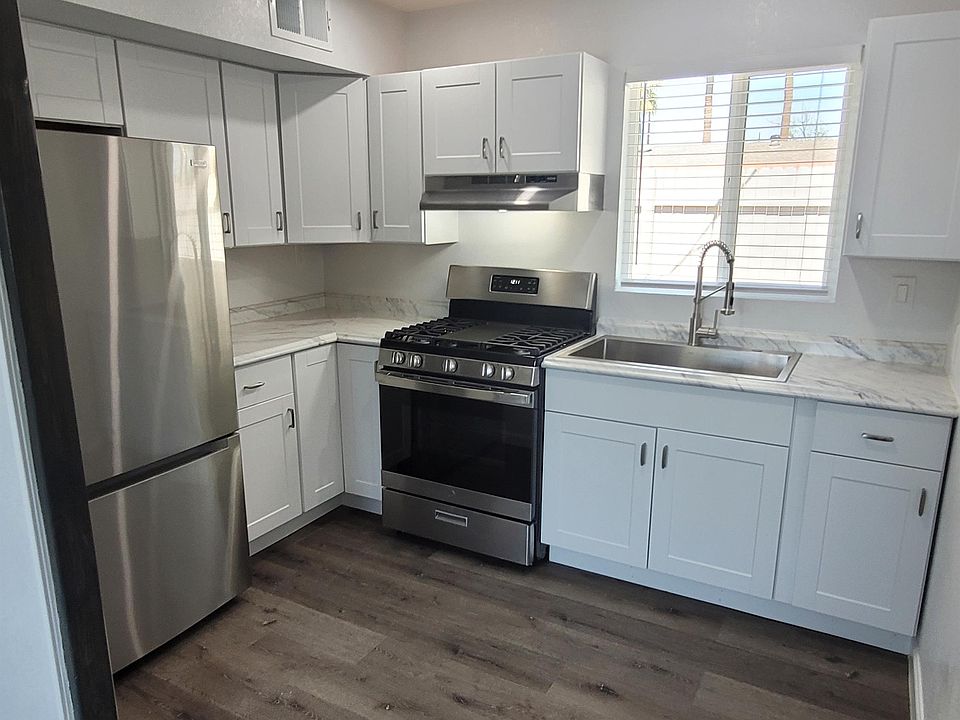 Full sized fridge with bottum freezer. Over sized gas range with center grill. Widow to back yard.