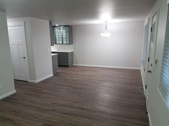 View back to dining and kitchen area. Door on left is large linen/storage closet.