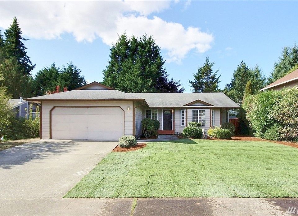 Open design rambler with new front lawn in quiet Lea Hill neighborhood.
