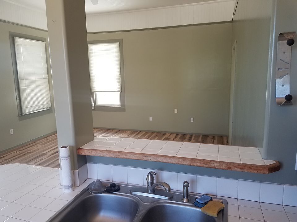 Looking over kitchen sink into livingroom.