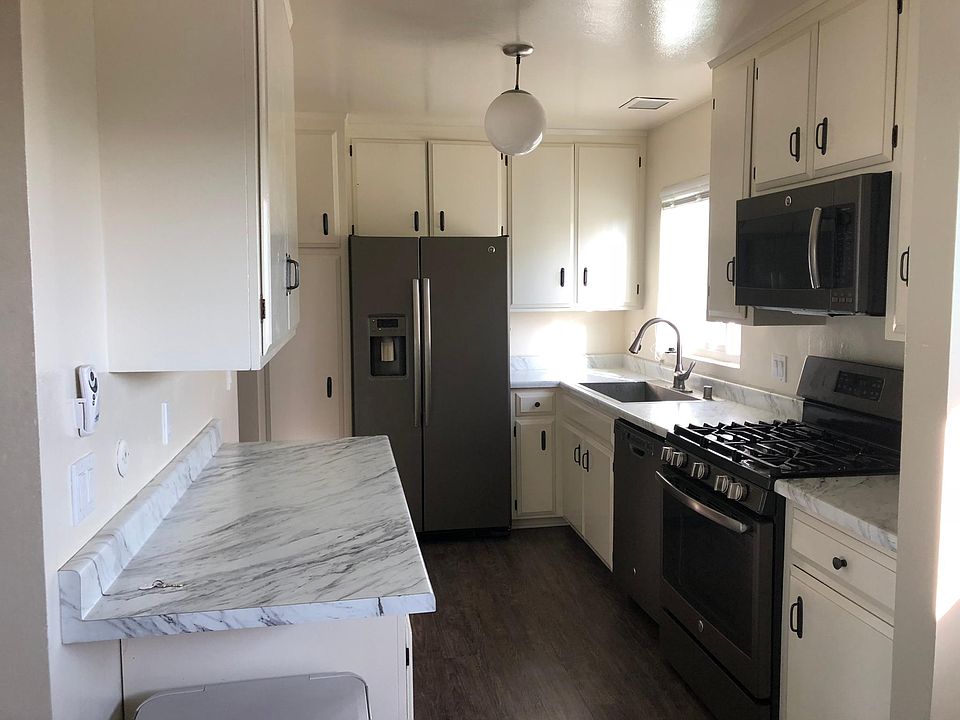 Updated kitchen opens to dining and living rooms.