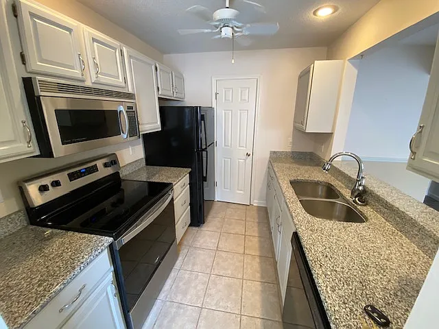 Kitchen with and door to pantry.