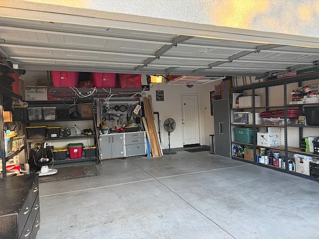 2 car automatic garage door with ample storage.
