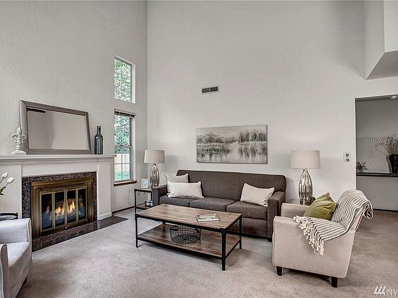 Hallway to the far right leads to primary bedroom and en suite.