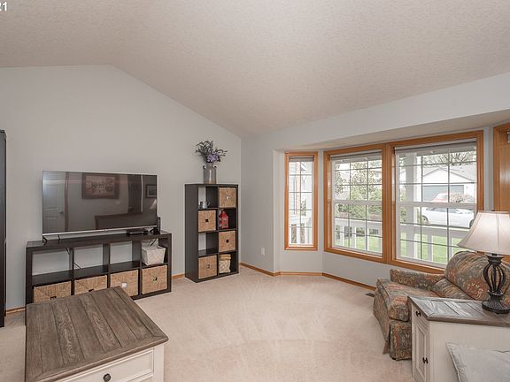 Living Room w/ Vaulted Ceiling and Bay Window