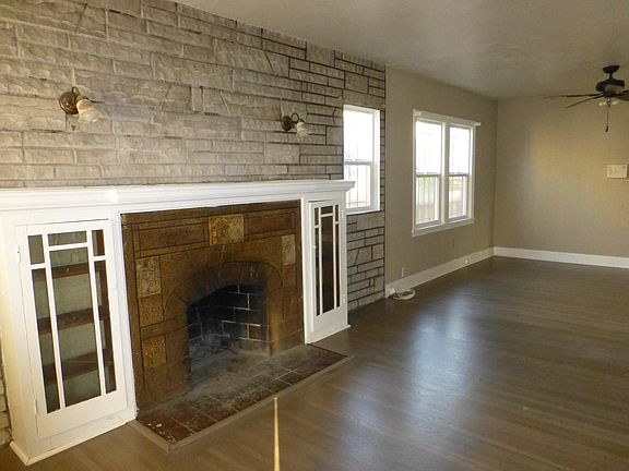 Combination Living room and dining room with beautiful hardwood floors.