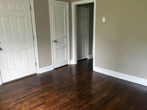 Living area features beautiful hardwood flooring.